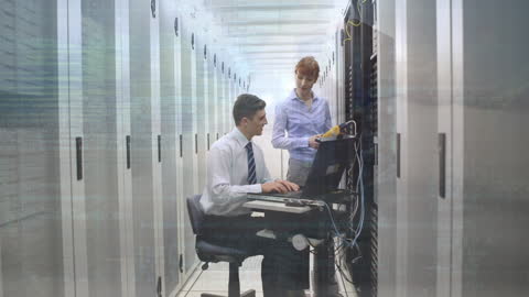 IT Technicians Working in Server Room with Digital Data Overlay