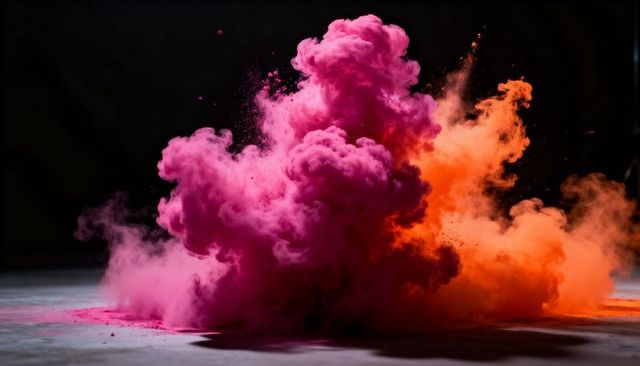 Billowing magenta and orange powder cloud exploding on dark floor with dramatic contrast