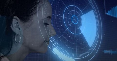Female technician interacting with holographic interface in laboratory