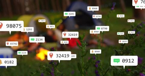 Augmented reality campsite overlays highlighting wildflowers with location tags and campfire glow
