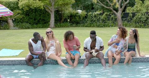 Diverse Friends Enjoy Relaxing Poolside Gathering - Download Free Stock Images Pikwizard.com