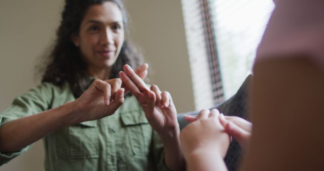 Woman Using Sign Language Communicating with Child Indoors - Download Free Stock Images Pikwizard.com