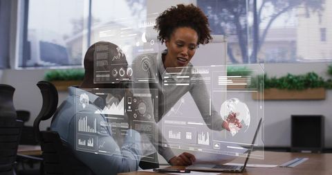 Diverse Team Analyzing Futuristic Financial Data Interface in Office