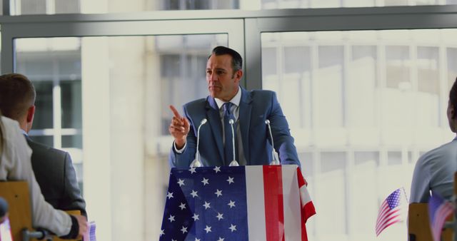 Politician Giving Speech at Rally with USA Flag at Podium - Download Free Stock Images Pikwizard.com