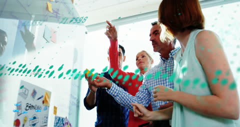 Diverse Team Analyzing Digital Data in Collaborative Meeting