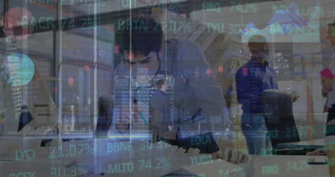 Business Team Analyzing Financial Data Qverlaid Graphs