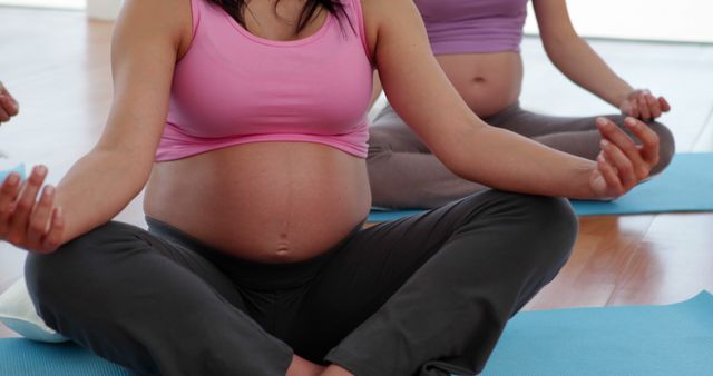 Pregnant Women Practicing Prenatal Yoga in Class - Download Free Stock Images Pikwizard.com