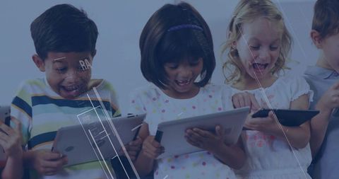 Diverse children excitedly using tablets for learning and play