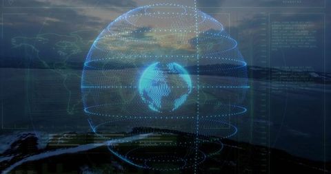 Futuristic holographic globe above ocean at dusk