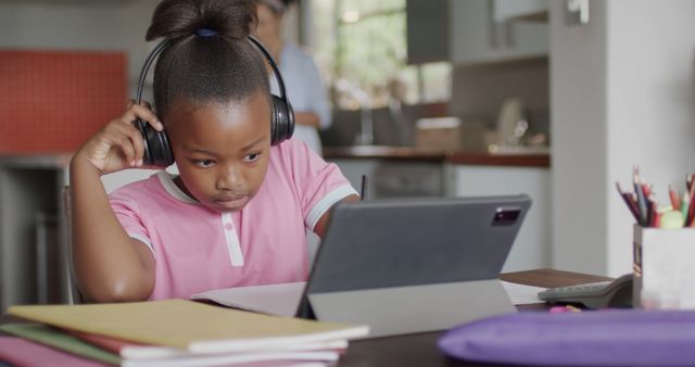 Focused Young Girl Using Tablet for Learning at Home - Download Free Stock Images Pikwizard.com