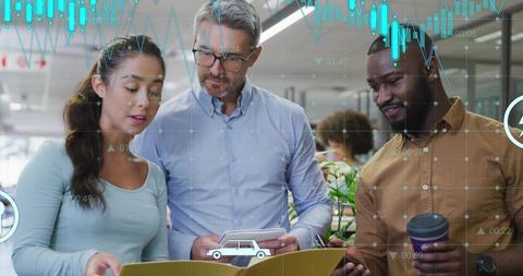 Diverse Professionals Reviewing Documents in Modern Office