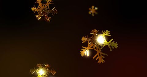 Gold Snowflakes Falling over Black Background Abstract Art