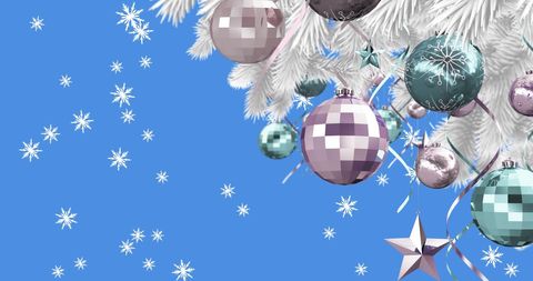 White Christmas Ornaments Hanging Against Blue Sky