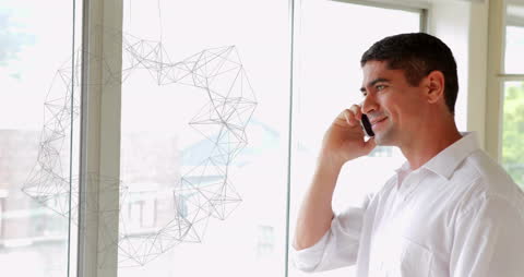 Smiling Man on Phone with Digital Network Overlay