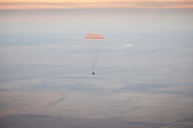 The Soyuz TMA-19 spacecraft is seen as it descends with Expedition 25 Commander Doug Wheelock and Flight Engineers Shannon Walker and Fyodor Yurchikhin near the town of Arkalyk, Kazakhstan on Friday, Nov. 26, 2010.  Russian Cosmonaut Yurchikhin and NASA Astronauts Wheelock and Walker, are returning from nearly six months onboard the International Space Station where they served as members of the Expedition 24 and 25 crews. Photo Credit: (NASA/Bill Ingalls)