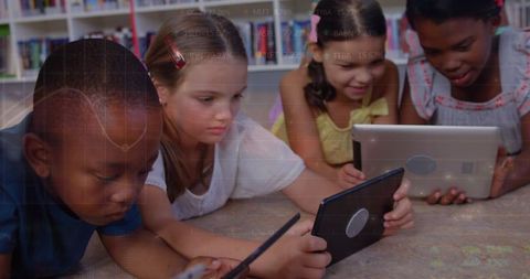 Diverse Children Studying with Tablets Overlaid with Graph Representations