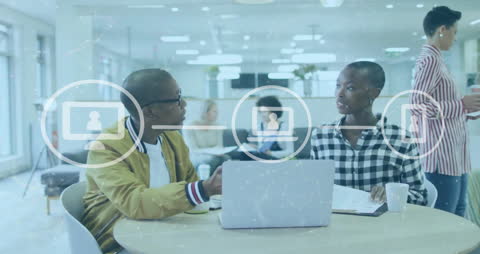 African American Colleagues in Tech-Centric Office Meeting