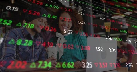 Young Couple Analyzing Stock Market Data in Cafe