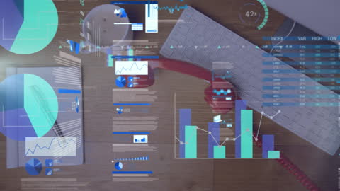 Animated Overlaid Data Graphics on Office Desk Workspace