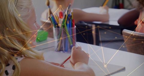 Young Student Engaged in Creative Classroom Activity with Art Supplies