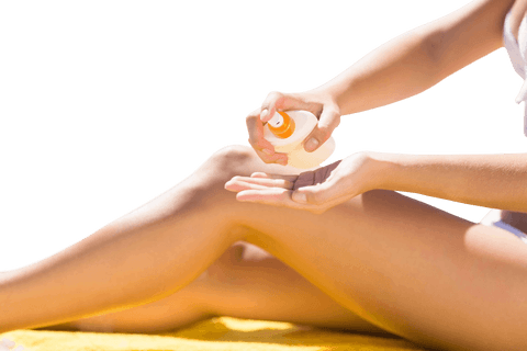 Woman applying tanning lotion outdoor taken with a transparent background