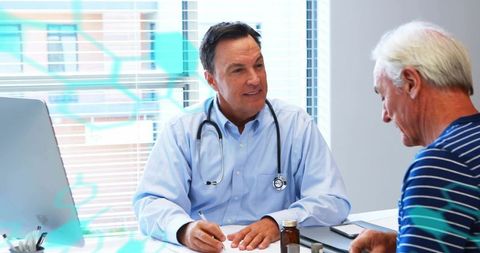 Male Doctor Consulting Senior Patient in Bright Clinic Office for Routine Medical Checkup