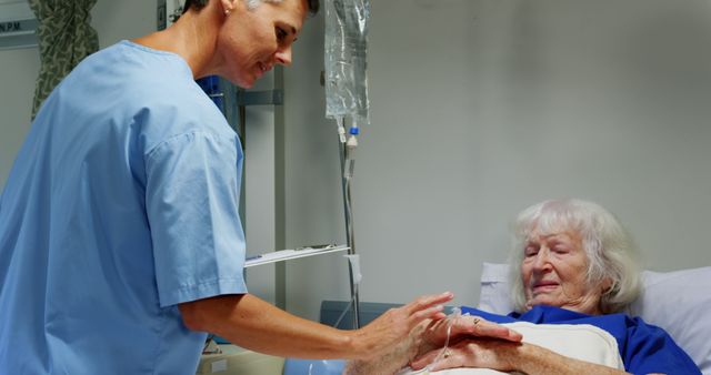 Nurse administering care to an elderly patient in a hospital ward. Useful for healthcare ads, articles about hospital care, medical research, nursing studies, and blogs focused on elderly care.