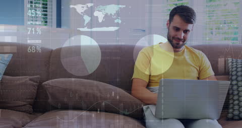 Man Using Laptop at Home Analyzing Business Data
