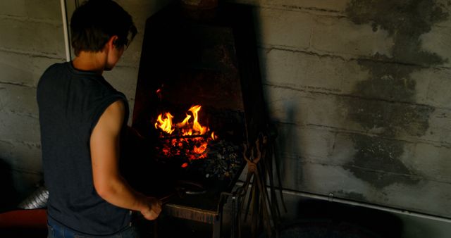 Blacksmith Working Metal in Workshop with Forge - Download Free Stock Images Pikwizard.com