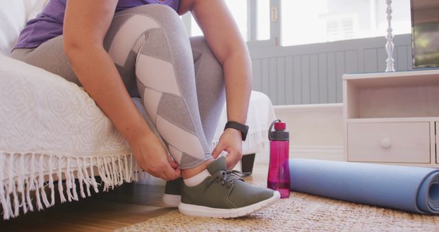 Woman Putting On Athletic Shoes Preparing For Home Workout - Download Free Stock Images Pikwizard.com