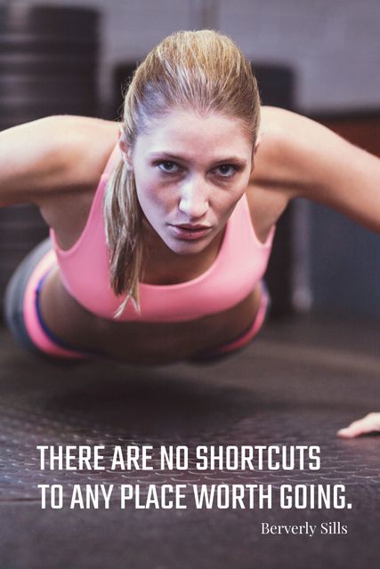 Focused woman doing push-up in gym illustrates strength and resilience. Ideal for fitness campaigns, motivational posters, and social media content promoting health and perseverance.