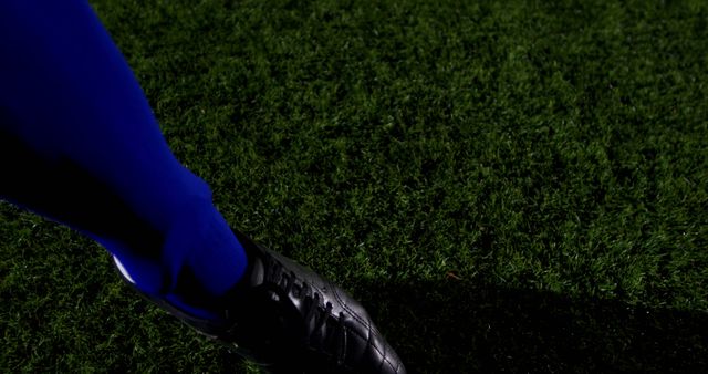 Close-Up of Soccer Player's Foot on Grass Field at Night - Download Free Stock Images Pikwizard.com