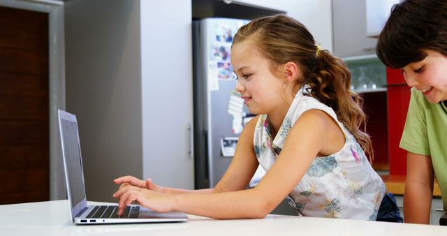 Two Caucasian Children Focused on Laptop Screen Learning Together at Home - Download Free Stock Images Pikwizard.com