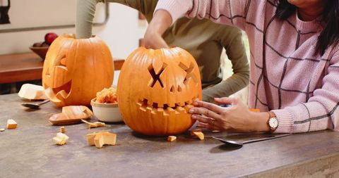 Multiracial Family Carving Pumpkins Together for Halloween Fun - Download Free Stock Images Pikwizard.com