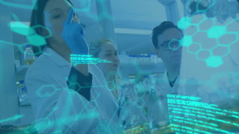 Diverse Team Analyzing Data in High-Tech Laboratory