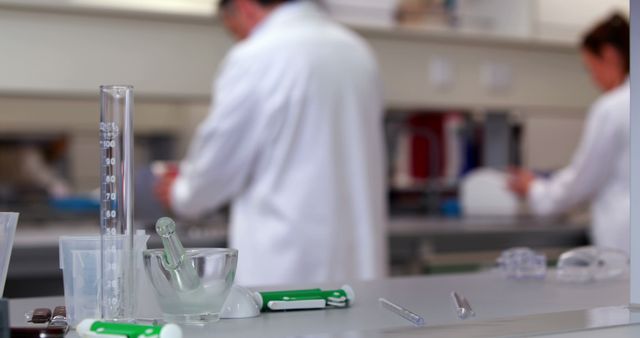 Scientists Working in Laboratory with Various Equipment on Table - Download Free Stock Images Pikwizard.com