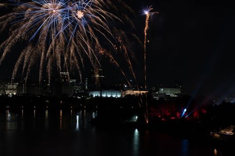 Spectacular Night Fireworks Over City Skyline