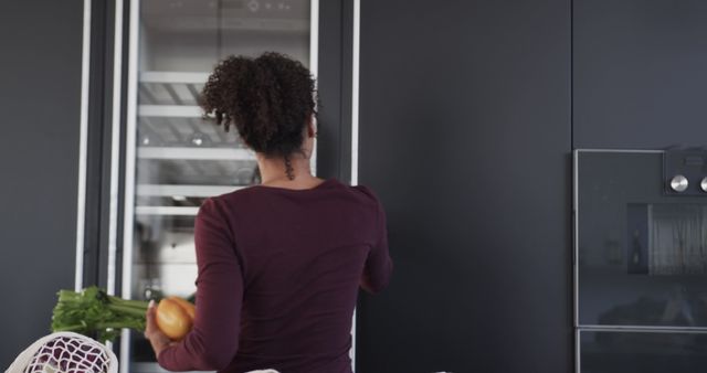 Woman Unpacking Groceries in Modern Kitchen - Download Free Stock Images Pikwizard.com