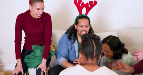Diverse Friends Relaxing at Festive Celebration at Home
