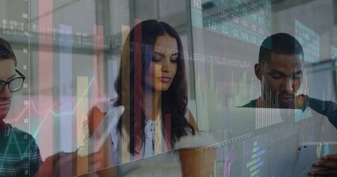 Business team collaborating with financial analytics in modern office