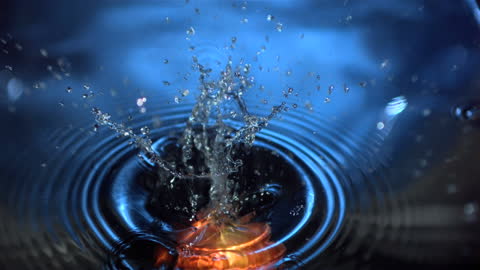 Red Apple Sinking and Water Splashing in Slow Motion