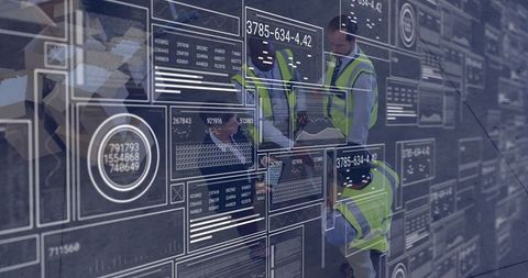 Engineers analyzing digital data on transparent screens