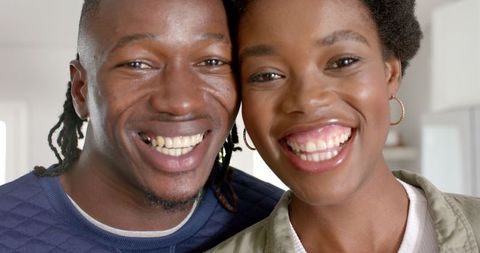 Happy African American Couple Smiling Warmly in Living Room