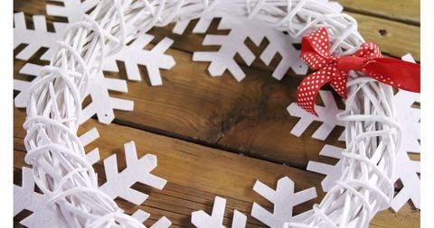 White Christmas Wreath with Red Bow on Craft Wooden Table - Download Free Stock Images Pikwizard.com