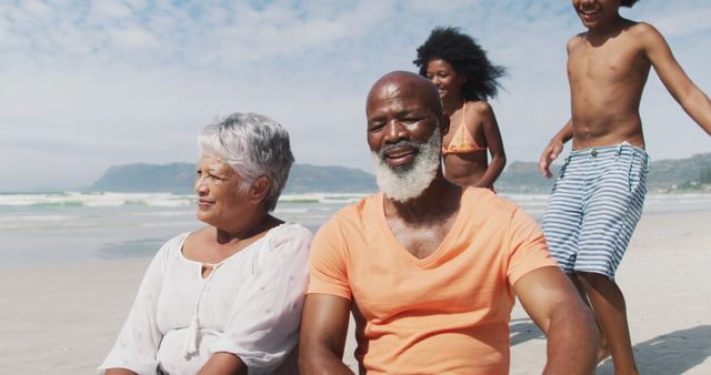 Happy Multi-generational Family Enjoying Sunny Beach Day - Download Free Stock Images Pikwizard.com