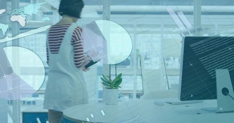 Analyzing data in modern office with digital interface overlays