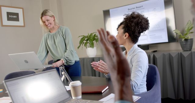 Female Leader Presenting Quarterly Report to Colleagues at Office Meeting - Download Free Stock Images Pikwizard.com