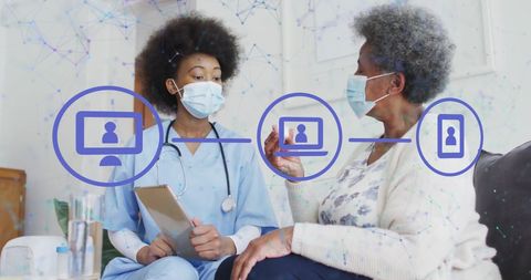 Healthcare professional and elderly patient discussing medical information