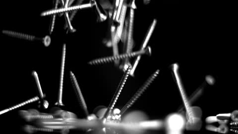 Mesmerizing Motion of Falling Screws in Black and White