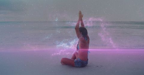 Woman meditating on beach with cosmic nebula overlay, yoga serenity at sea horizon